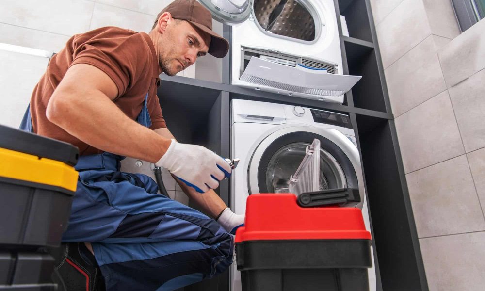 handyman-repairing-a-washing-machine.jpg